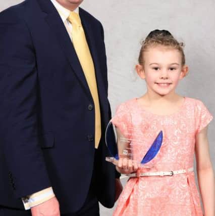 Achievement performance of the year junior female Grace Dickinson with Kevin Carey