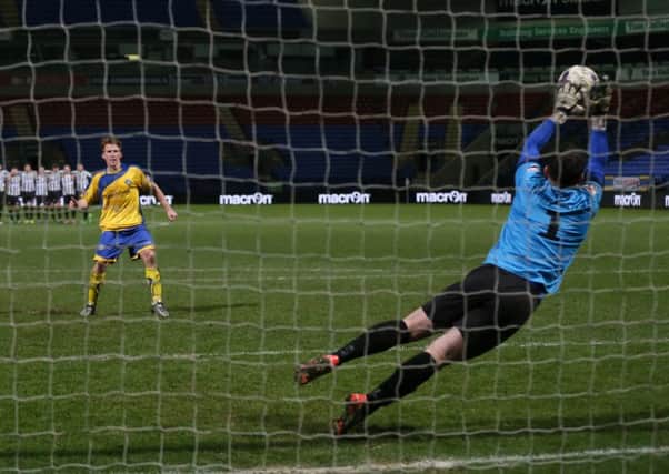 Lancaster's Craig Carney has his penalty saved by Chorley's Sam Ashton