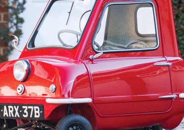 A classic British motor which holds the title of world's smallest production car has been sold for a record-breaking Â£122,700.