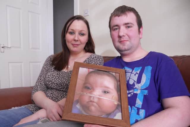 Martin Tootell and Christy Bates with picture of baby Scarlett-Rose
