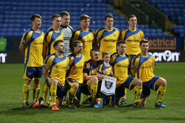 Lancaster City line up before the Lancashire FA Challenge Trophy