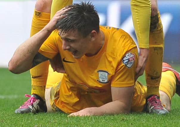 Jordan Hugill holds his head after getting 
in where it hurts at Bolton