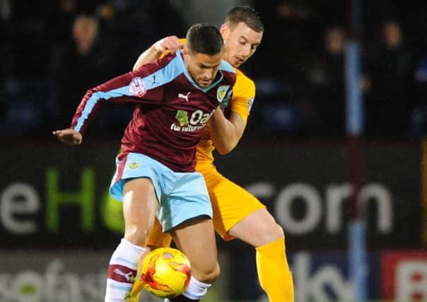 Preston's Marnick Vermijl keeps a close eye on Michael Kightly when Preston defeated Burnley at Turf Moor