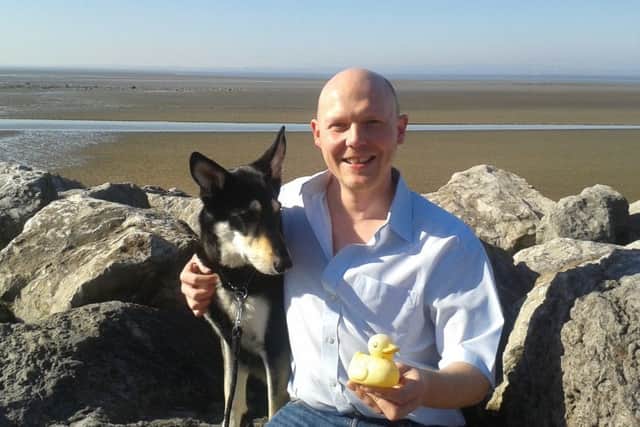 Nick Westell with Skye and the Irish rubber duck he found on Morecambe beach on St Patrick's Day.