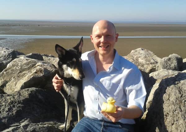 Nick Westell with Skye and the Irish rubber duck he found on Morecambe beach on St Patrick's Day.