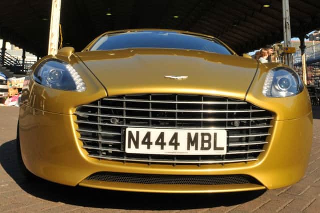 Could it be you?: Hardeep Karir in the  one-off, specially designed gold Aston Martin in Preston