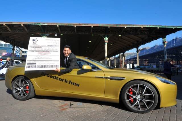 Could it be you?: Hardeep Karir in the  one-off, specially designed gold Aston Martin in Preston