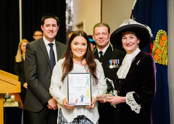 AWARD: Philippa Richings with Simon Bee from BAE Systems, Assistant Chief Constable Mark Bates and High Sheriff, Amanda Parker