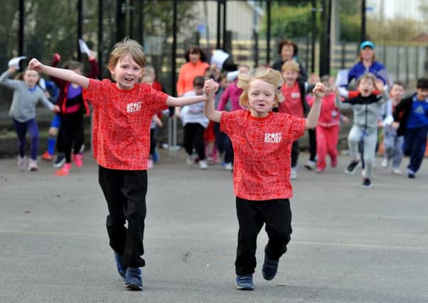 Photo Neil Cross
Ric Clarke's two young sons Oscar and Sidney leading the Sport Relief run in memory of Ric at Cop Lane CE Primary School, Penwortham