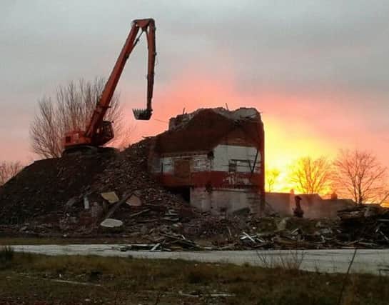 The last bit of Wesley Street Mill comes down. Picture by Jason Yates