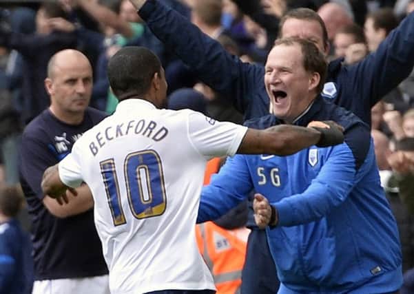 Jermaine Beckford celebrates with Simon Grayson after scoring against Chesterfield last May