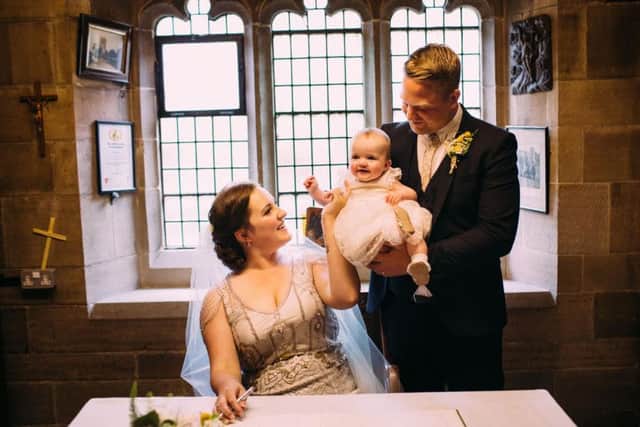 Dave Wall, wife Hannah and daughter Imogen on their wedding day in May 2015