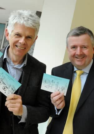 LEP  22-03-16
Artist Chirs Murphy, left, has created large murals of landmarks in Preston, unveiled on the top floor of St George's Centre, Preston, to mark 50 year anniversary of the centre, pictured with centre manager Andrew Stringer, right, holding postcards of the art, which are to be given out free to shoppers.