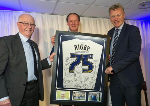 Russ Rigby (left) is presented with a signed shirt by Simon Grayson and David Moyes