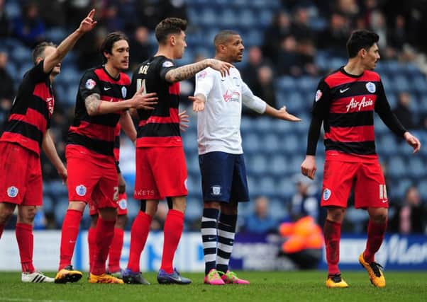 Jermaine Beckford is policed by four QPR players on his return to action after a long-term injury last week