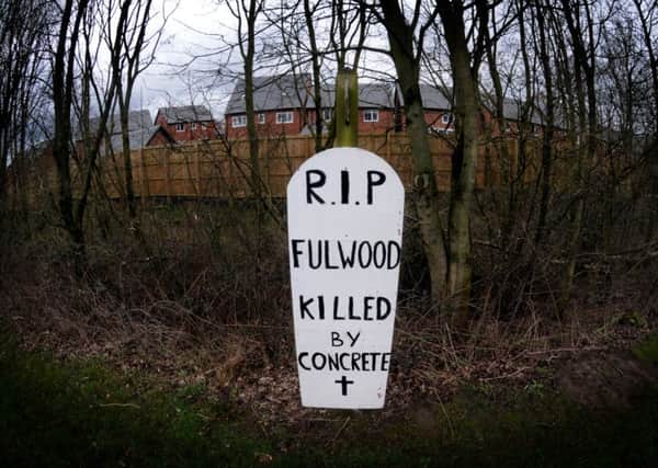 A fake tombstone has been erected by the side of the road on Eastway in Fulwood, bemoaning the amount of construction in the area