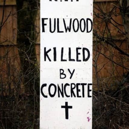 A fake tombstone has been erected by the side of the road on Eastway in Fulwood, bemoaning the amount of construction in the area