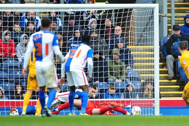 Blackburn Rovers' Shane Duffy dives along the goal-line as he blocks a shot at goal from Preston North End's Jordan Hugill - giving away a penalty and earning himself a red card