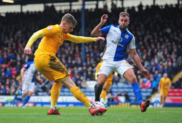 Calum Woods vies for possession with Blackburn Rovers' Tommy Spurr