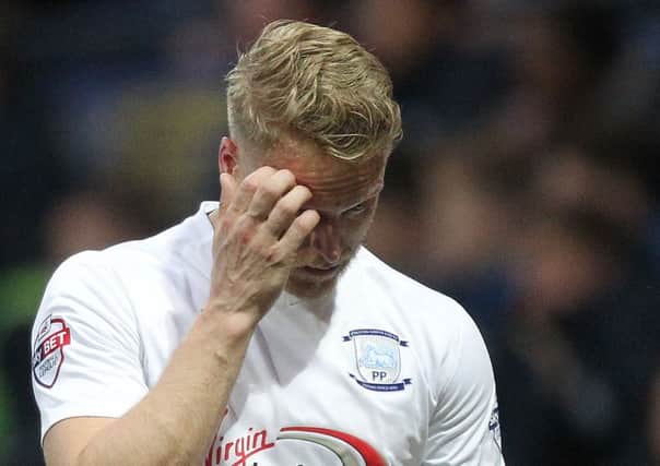 Preston North End's Tom Clarke leaves the pitch with a head injury