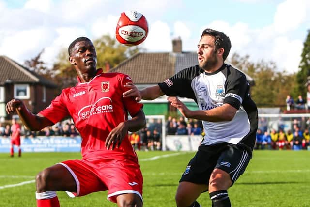Matty Kay (right) challenges Chorley's Darren Stephenson during a FA Cup tie (photo: Paul Vause)