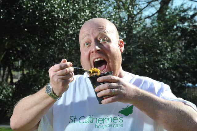 Photo Neil Cross
Volunteer chef and self confessed hot head Carl Redman attempting to eat the world's hottest pot noodle at St Catherine's Hospice