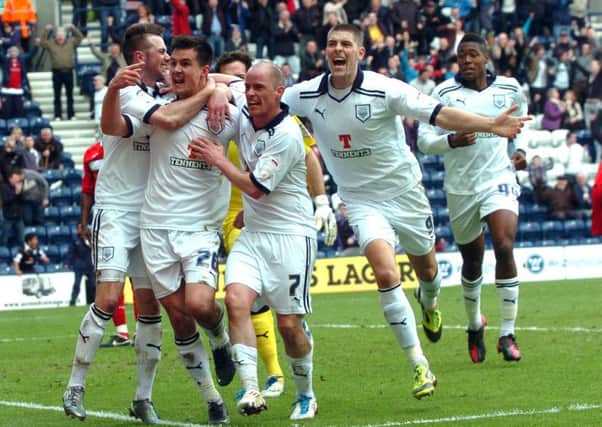 Bailey Wright is congratulated by Chris Holroyd, Iain Hume and Jamie Proctor after his equaliser against MK Dons in April 2012
