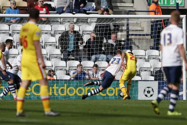 Nicky Maynard beats Paul Huntington to the ball and scores the equalising goal