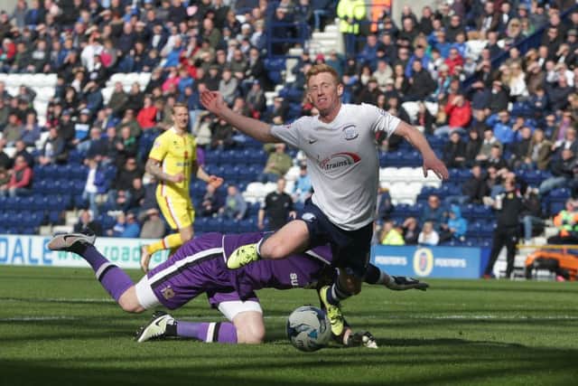 Cody Cropper was shown a straight red card for this foul in the penalty area on  Eoin Doyle