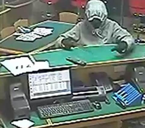 CCTV of a knife-point robbery at Betfred in Granton Walk, Ingol on April 17