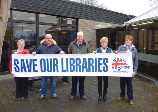 Left to right - Councillors Alice Collinson, Shaun Turner, Tom Balmain,mar Lady Dulcie Atkins and County Councillor Vivien Taylor with thier save our libraries banner.