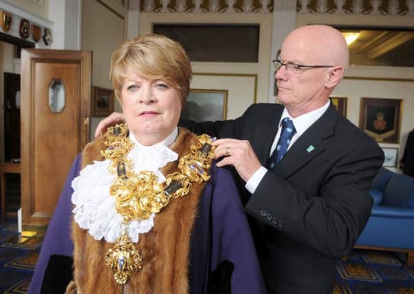 Veronica Afrin with Mayoral Officer Jim Rowley as they put on the Mayoral Chain, when Coun Afrin became mayor