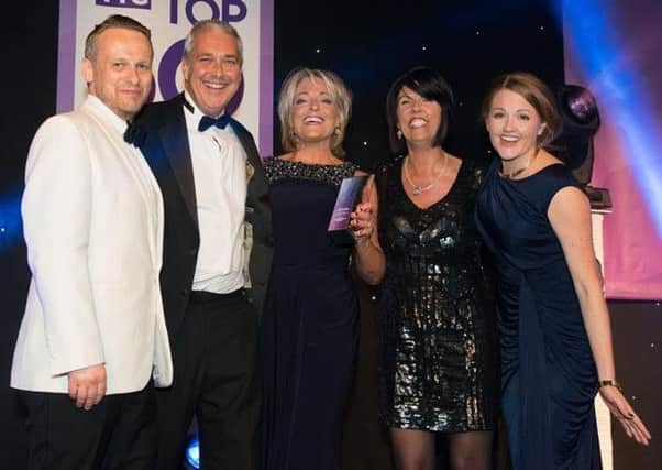 Garstang Travel's owner Nicole Eaves (centre) and assistant manager Karen Hall (second from right) pick up their trophy at the TTG Top 50 ceremony from TTG Media managing director Daniel Pearce (left), TTG editor Pippa Jacks (right), and Jeremy McKenna of sponsor Norwegian Cruise Line