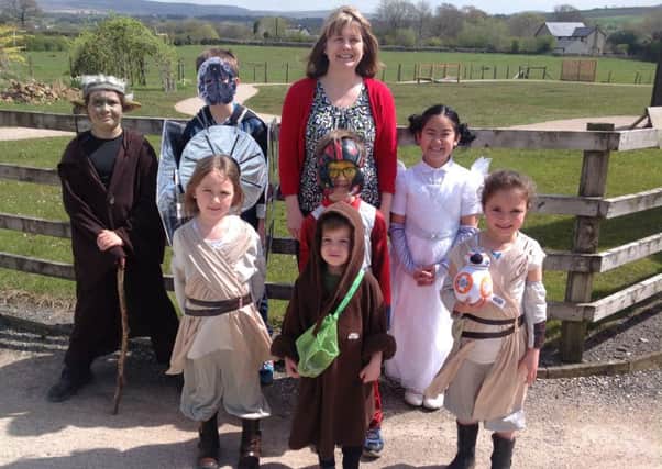Children from Dolphinholme C of E Primary School celebrate the unofficial Star Wars Day of May 4 by dressing up as characters from the sci-fi franchise. Also pictured is new head teacher Dianne Cross.