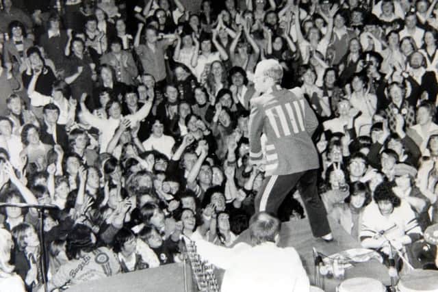 Elton John entertains the fans at Preston Guild Hall concert in May 1976