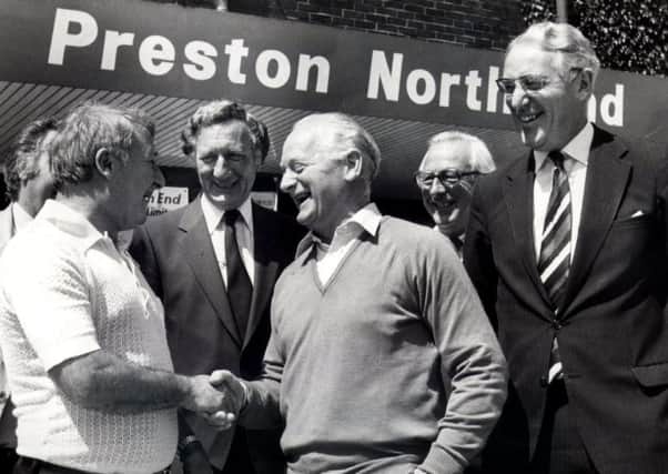 Alan Jones (pictured far right) watches Sir Tom Finney welcome Tommy Docherty to Deepdale