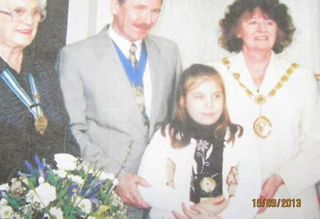 Storm at the age of eight receiving her bravery award after saving her six-year-old brother Jacob's life after he fell into a pond