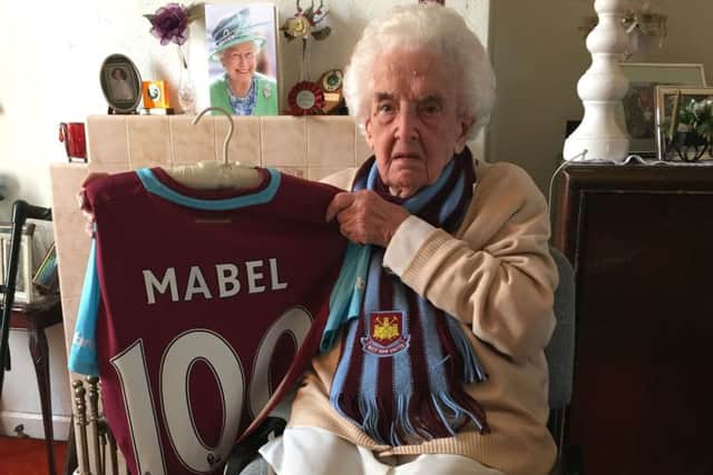 100-year-old West Ham United fan Mabel Arnold, who was presented with a home shirt in front of the crowd at Upton Park to celebrate her 100th birthday in April. PRESS ASSOCIATION Photo. Picture date: Friday May 6, 2016. See PA story SOCCER West Ham Arnold. Photo credit should read: Tom Allnutt/PA Wire.