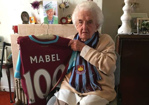 100-year-old West Ham United fan Mabel Arnold, who was presented with a home shirt in front of the crowd at Upton Park to celebrate her 100th birthday in April. PRESS ASSOCIATION Photo. Picture date: Friday May 6, 2016. See PA story SOCCER West Ham Arnold. Photo credit should read: Tom Allnutt/PA Wire.