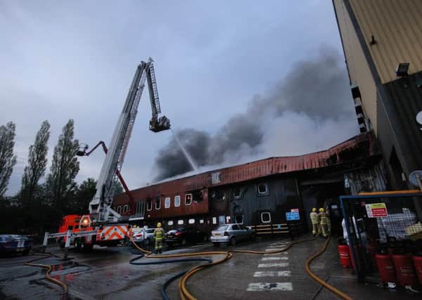 PROBE: Fire experts are examining the wreckage of the plastics factory to establish what caused yesterdays huge blaze