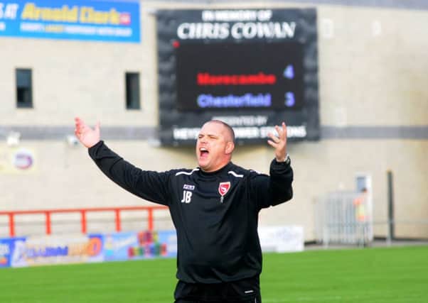 Jim Bentley celebrates Morecambe's dramatic win over Chesterfield. Picture: Garth Hamer