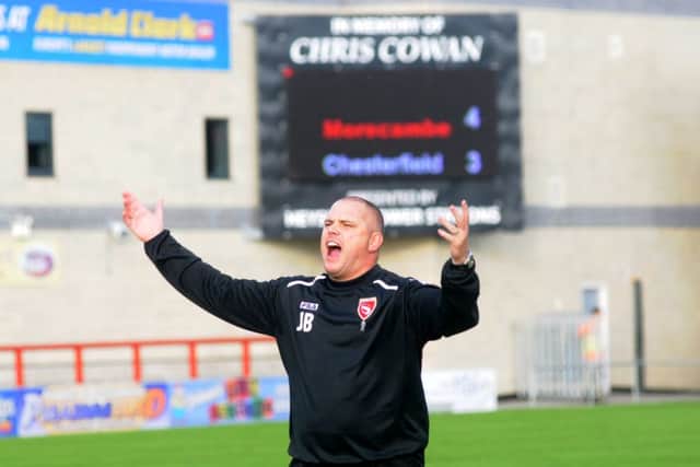 Jim Bentley celebrates Morecambe's dramatic win over Chesterfield. Picture: Garth Hamer