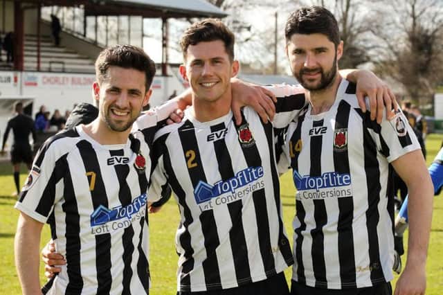 Mark Rossflankled by Chorley team-mates Paul Jarvis, and Adam Roscoe