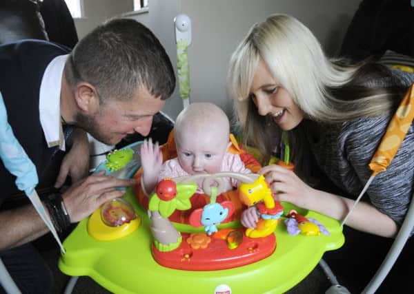 Glenn Salmon and partner Lindsey Drinnan at home with daughter Lucy-Mae Salmon in Bispham