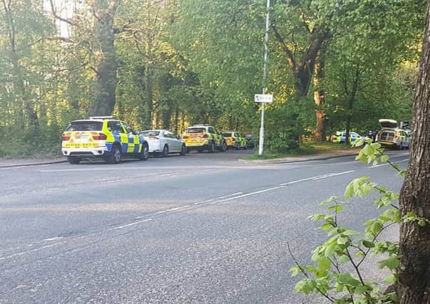 Police cars and paramedics at Williamson Park in Lancaster after a man was spotted with a shotgun. Picture by Shane Ogley.