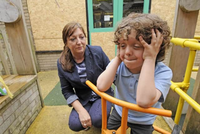 Acorns Primary School have been suffering from vandals attacking the school over recent months.  Pictured is pupil Daniel Baron, aged 8 with headteacher Gail Beaton.