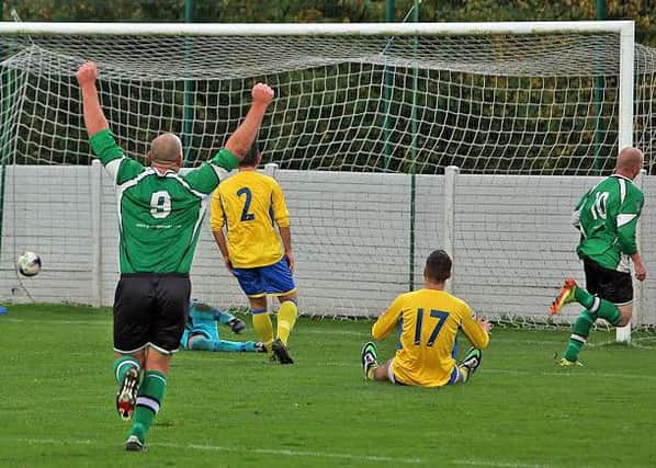Dave Burrows scores for Charnock and Carl Grimshaw celebrates (photo Ken Chapman)