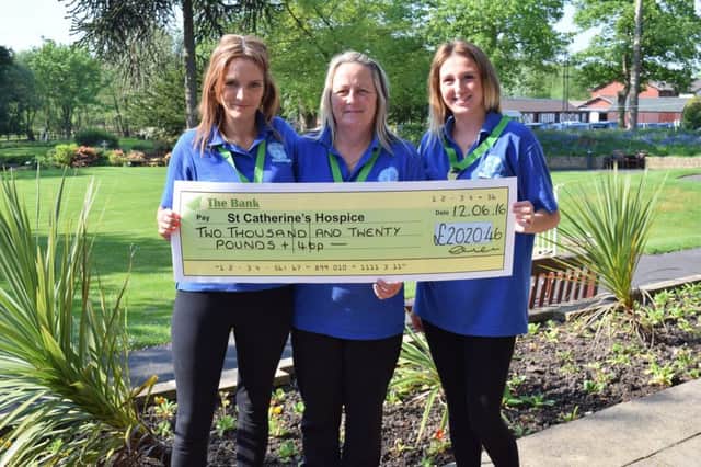 Fairy God Dusters Emma Procter, Donna Knowles and Megan Stewart visited St Catherines Hospice after raising more than Â£2,000 for the charity.