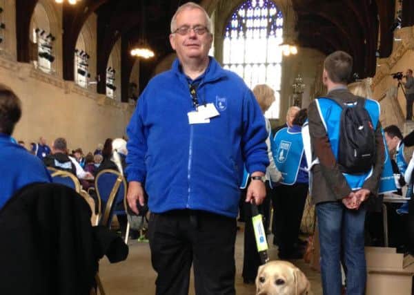 Alan Hughes with his guide dog Kim were part of a delegation who visited the House of Commons to lobby for it to become illegal for a taxi driver to refuse to take a guide dog