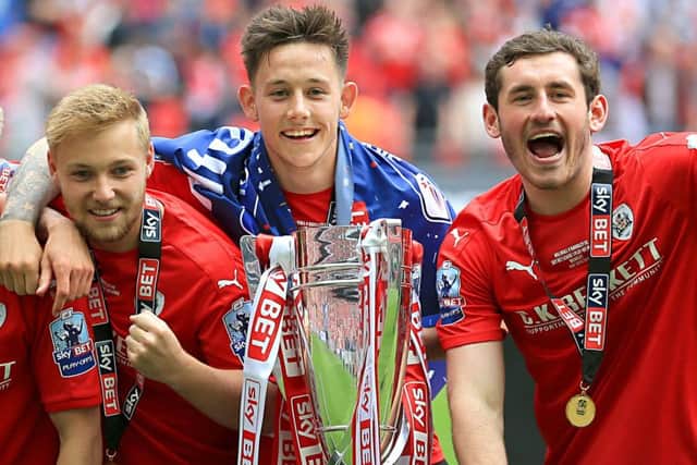 Josh Brownhill (centre) with the League One play-off final trophy on Sunday